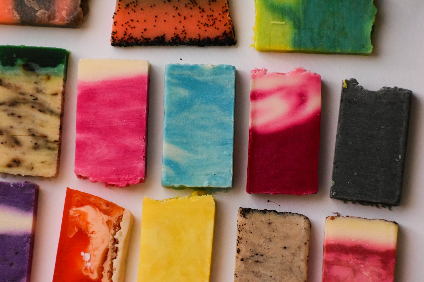 Assorted handmade soap bars with unique colors and patterns.